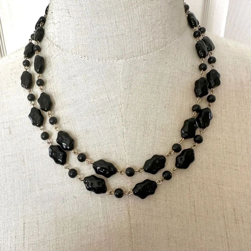 Black glass beads and gold tone long vintage necklace